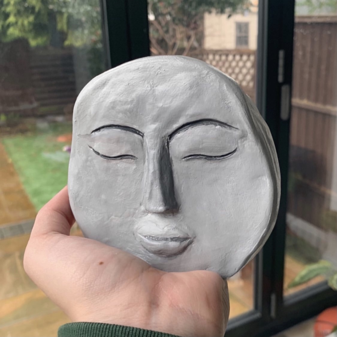 moon faced candle vase